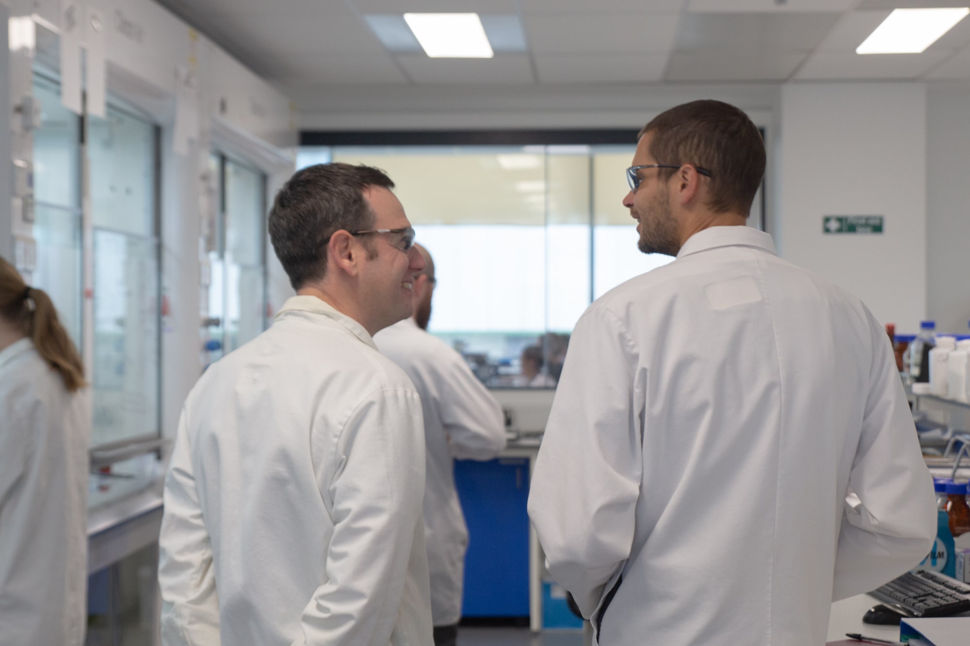 Scientist lab coats backs