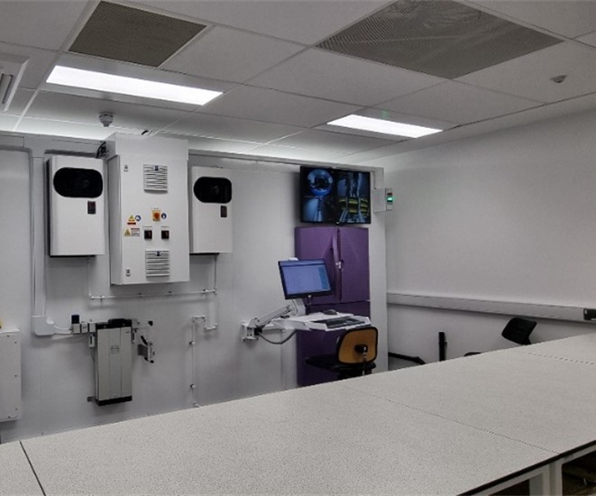 Laboratory automation setup featuring high-throughput screening equipment and integrated compound management systems for drug discovery.