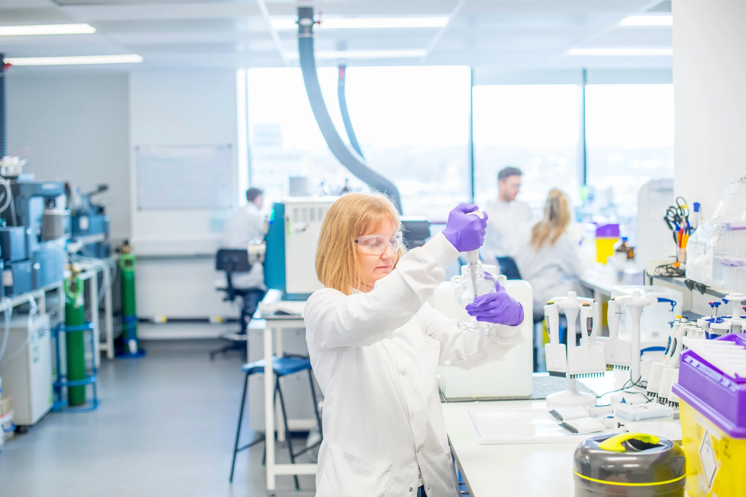 Laboratory setup with automated systems and analytical instruments used for chemical and metabolic stability assays, supporting predictive pharmacokinetic insights.