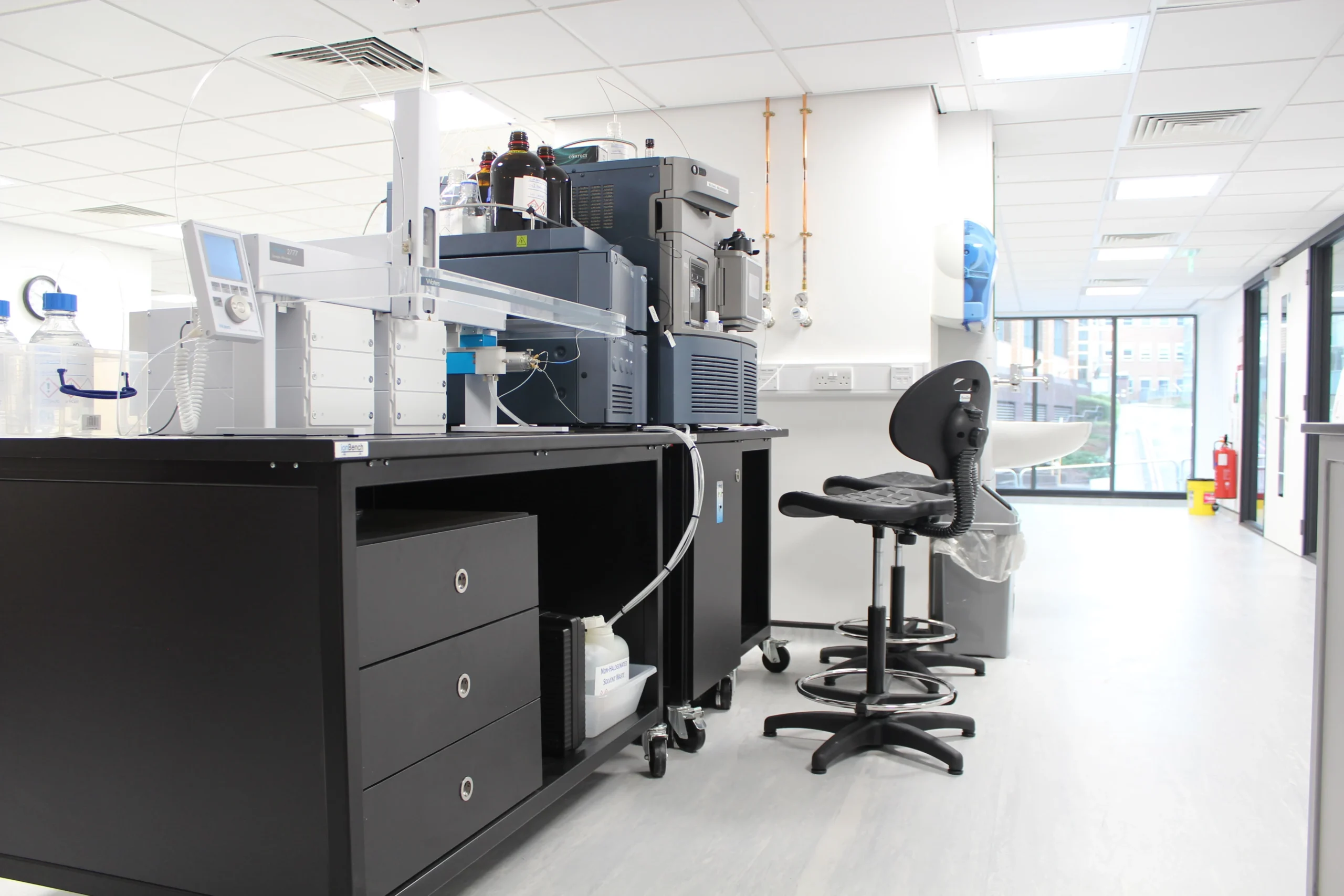 Laboratory environment with advanced analytical instruments representing drug metabolism and pharmacokinetics (DMPK) studies for rational design and decision-making.