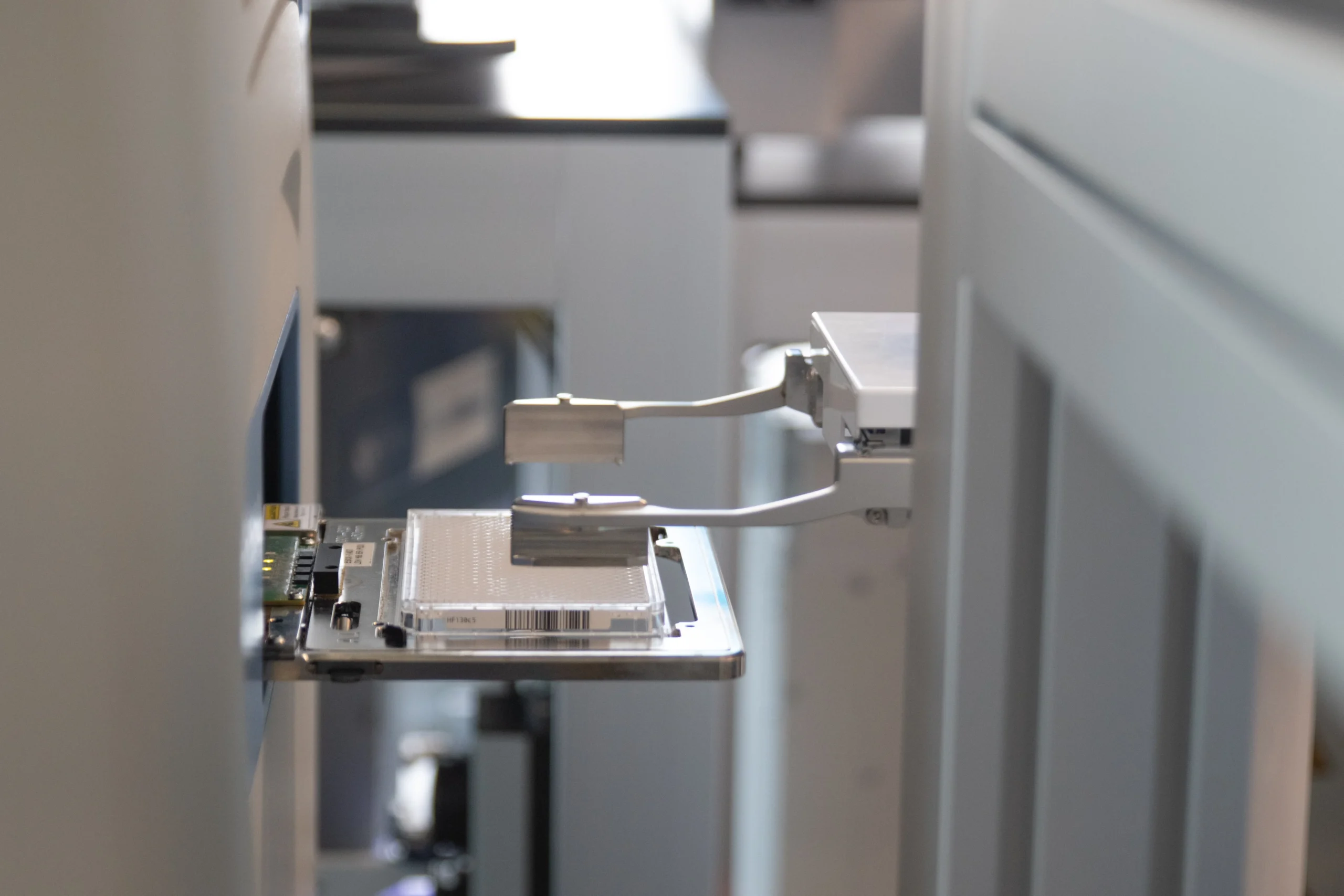 Automated laboratory system performing high-throughput screening to accelerate drug discovery and compound testing.