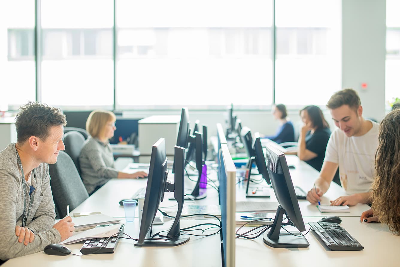 team collaborating on informatics solutions for early-stage drug discovery.