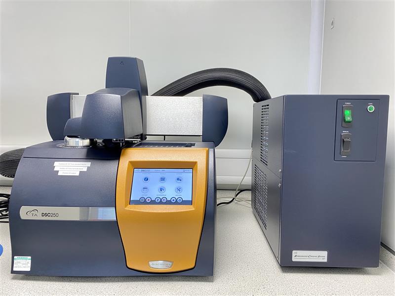 Laboratory instruments including an orange and gray analytical system on a benchtop, representing solid form screening and crystallization analysis using XRPD, DSC, and related techniques.