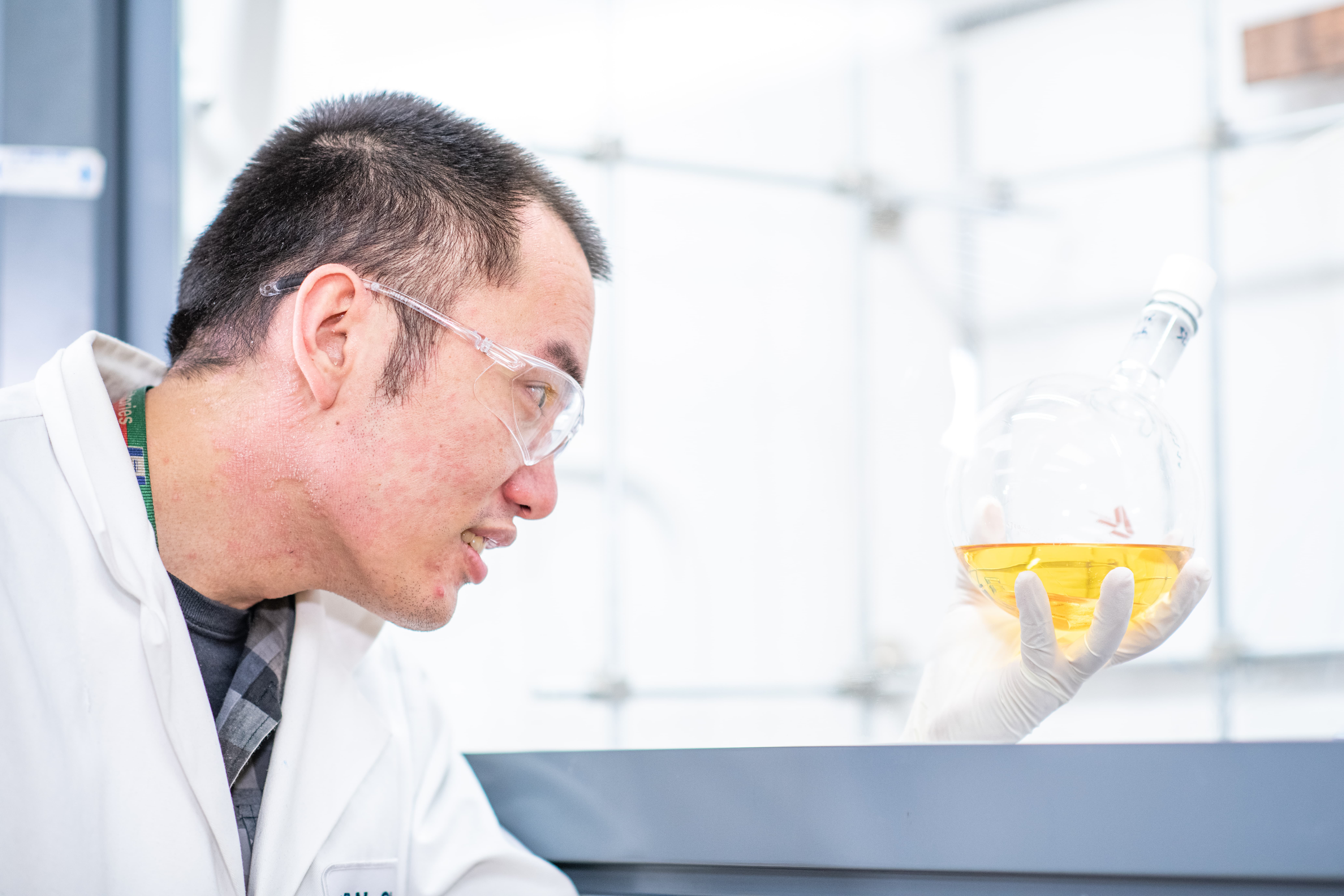 Laboratory environment featuring advanced equipment for synthetic chemistry, illustrating rapid design and synthesis of complex molecules for drug discovery.