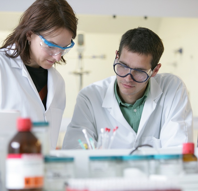 scientists reviewing work chemistry