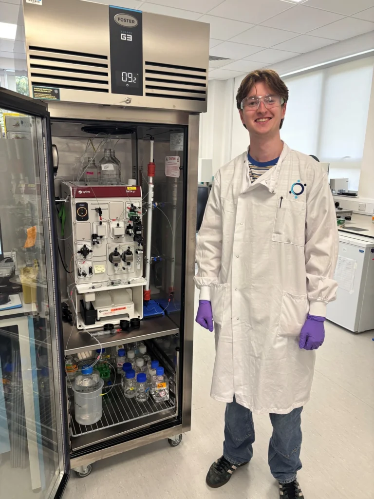 James McAfee with an AKTA chromatography system